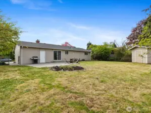 Nice sized back yard with large patio off the slider and a large storage shed.