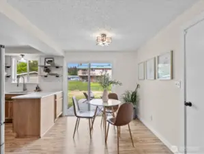 Dining area off the kitchen with slider to the backyard
