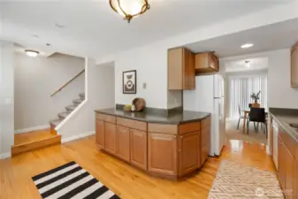 A view from the kitchen into the dining area and up the stairs to the bedrooms. Wouldn't that counter make a great coffee bar?