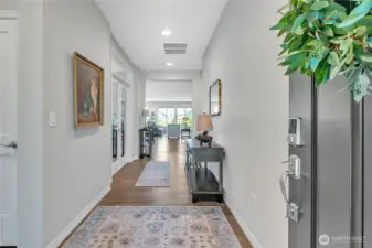 Front Entry. Guest Suite to immediate Left. Den/Office through Glass French Doors ahead on left. Straight ahead to the Open Concept Kitchen/Dining/Lounge/Great Room.