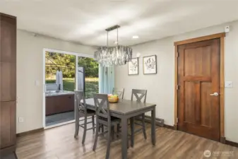 Through the sliding door leads to a large patio for seating plus an 8-person hot tub