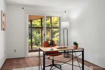 Behind this offie you can see an enclosed sun porch that can be used in a variety of ways!