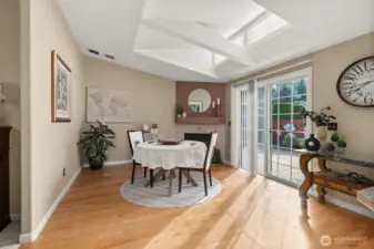 Cozy space with gas fireplace and sliding doors to the patio.