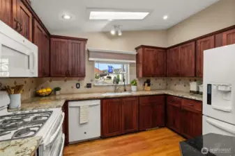 Tile backsplash, ample counter space, and a view from the sink.