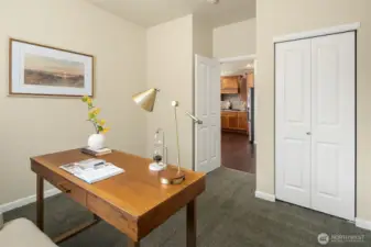Main floor office/bedroom/flex space, across the hall from powder room with shower.