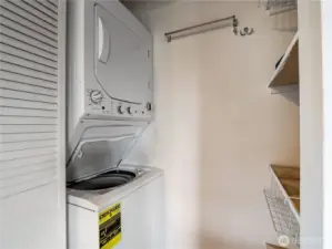 Washer dryer behind the louvered doors.