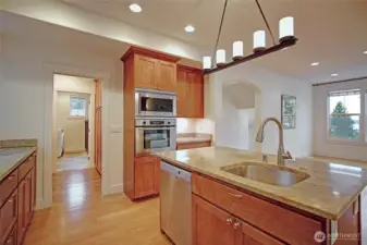 The Kitchen is open to to dining room. The doorway straight ahead leads into the butlers pantry & laundry room.