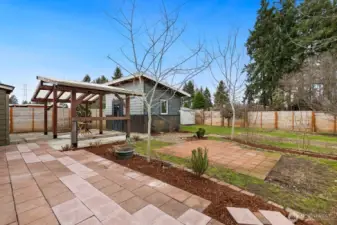 Yard features walking paths, patios, mature trees and plants - a true gardener's paradise!