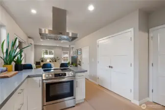 Additional storage in the pantry closet to the right, and above the laundry machines.