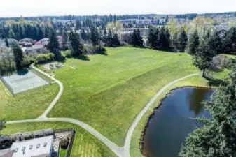 Trail Lake park with Tennis Court, play gym, soccer field and the baseball backstop.