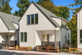 Welcome home to 2214 NE 125th Street at Thornton Creek Commons.  This light filled west-facing home is in a premium location in the community and overlooks the permanently preserved woodland open space and lush common gardens.