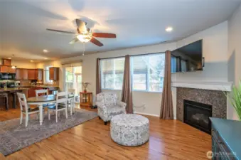 Oversized double windows brighten the family room and provide a lovely view of the covered patio and fully fenced yard.