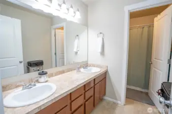 Generously sized, the upper-level main guest bath provides both comfort and functionality for visiting guests.