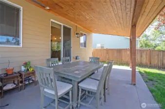 Enjoy outdoor living year-round on the covered patio, perfect for dining, entertaining, or relaxing beneath the beautifully crafted tongue-and-groove ceiling.