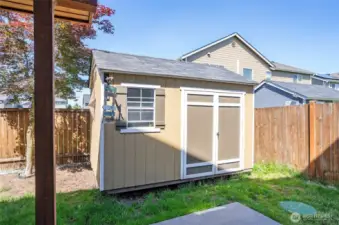 A great addition, the storage shed sits neatly in the back corner of the yard, offering extra space and organization.