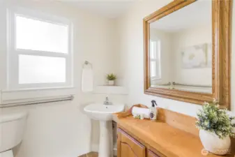 Large bathroom with cabinet and mirror that convey.