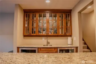 Custom cabinet, sink, wine and beverage coolers and granite counters