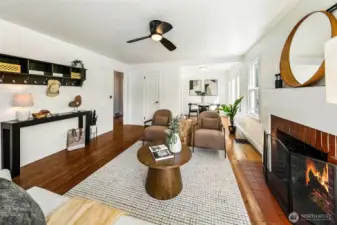 Living room and dining room are distinct and also open to each other.
