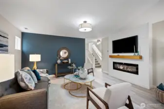 The inviting family room complete with shiplap mantel and electric fireplace added this year