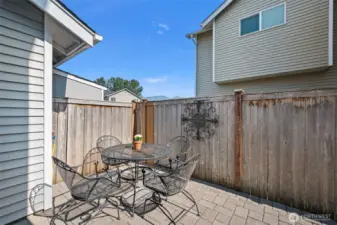 Paved backyard with a gas hookup for the barbecue