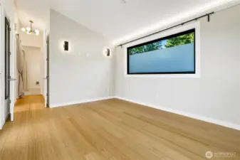 indirect wall lighting to warm the room. Vaulted ceiling make the room live large