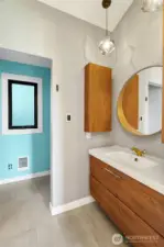 Floating cabinet, updated lighting, and heated tile floors