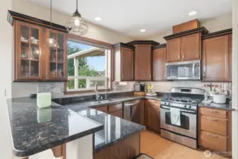 Large kitchen with granite countertops