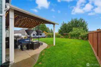 Fenced backyard is south facing and provides plenty of sunshine for playing, gardening, or entertaining