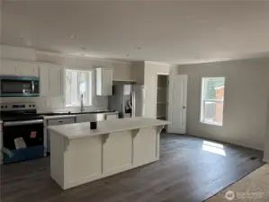 Kitchen with Large Island, Dining Area and Pantry