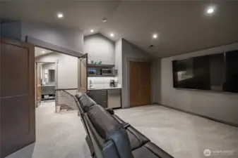 Upstairs bedroom, looking into the ensuite and mini bar.