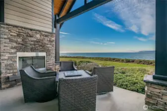 Patio with outdoor fireplace.