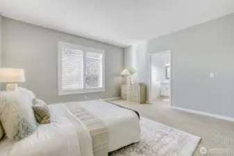 Primary bedroom w/ ensuite