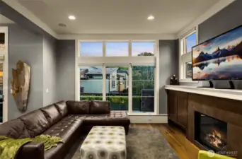 Gas fireplace and floor to ceiling windows