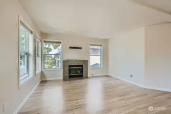 Light filled corner unit.  Living Room with gas fireplace