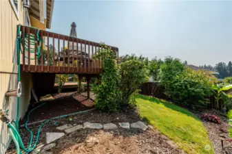 lower yard with view of deck