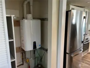 Propane on-demand water heater.  You can literally shower all day.