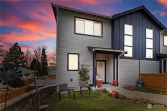 This remodeled townhouse with modern architecture offers stylish contemporary living. This townhouse has two entries. One entry opens on the main level located next to the garage and this pictured entry opens to the upper level with a great room.