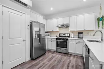 A full height backsplash adds to the appeal of this kitchen.