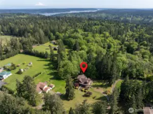 Aerial view of neighborhood.  Most homes in the area are on at least a couple of acres.  Country farm feeling.  Quiet road with no through traffic.  Near Colvos Passage boat launch in Olalla.