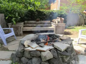 Back yard fire pit  with built in  sitting area.