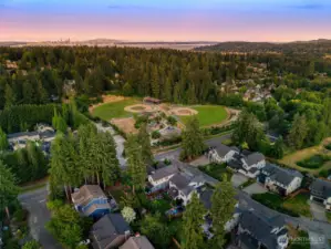 Enjoy the perfect balance of peaceful neighborhood living and outdoor recreation, with a community park and ball fields just steps from your door. Nestled among towering evergreens and minutes from town, this location offers both serenity and convenience
