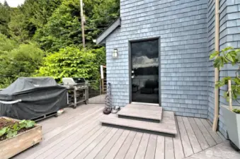 This door leads to a small but convenient workshop righ off the deck.