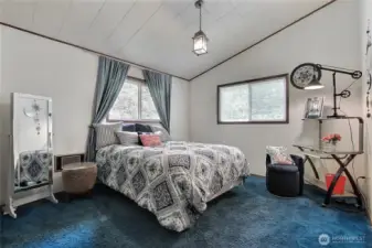 Another bedroom with plenty of light and vaulted ceilings.