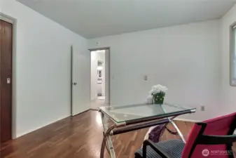 This home provides for so many options such as this flexible room with hardwood floors.