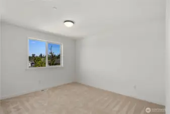 Secondary Bedroom: Spacious bedroom with plush carpet and a large window that brings in plenty of natural light. Neutral finishes provide a versatile setting ready for your personal touch. Staged photos are of the model home of the same floorplan within the Foxmoore community and are for visualization purposes only. Colors, finishes, and layout can and will vary.