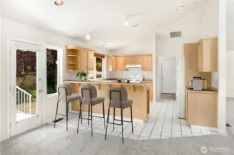 Kitchen opens to hearth room and easy access to deck. virtually staged