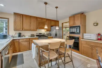 The kitchen is beautiful and filled with abundant cabinets. It features a stove/oven, a separate oven, and a convection microwave, making meal preparation for a crowd convenient and easy.