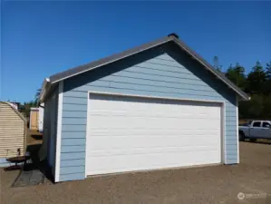 Detached double car garage with heated concrete floor for use as a shop or storage for your classic car.