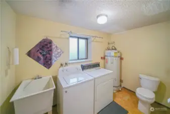 Lower level laundry and 1/4 bathroom