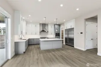 Actual kitchen with custom lighting, quality cabinets with soft close doors and drawers and walk in pantry!